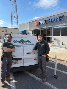 Philadelphia Locksmits technicians beside service van in Philadelphia PA