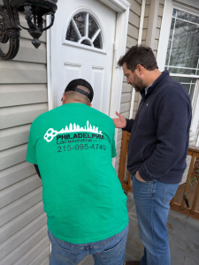 Philadelphia Locksmiths technician helping a customer at a home in Philadelphia PA